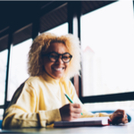 woman happily writing